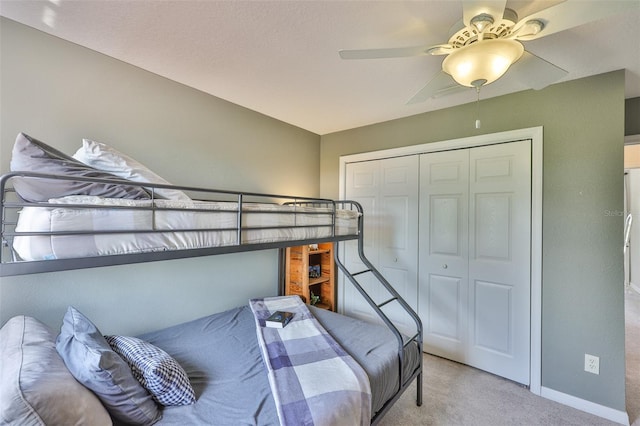 6468 Rubia Cir, Apollo Beach, FL 33572 - bedroom featuring light colored carpet, a closet, baseboards, and a ceiling fan