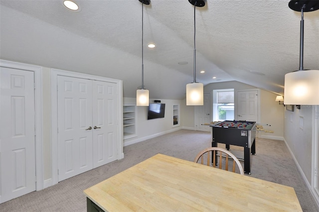 6468 Rubia Cir, Apollo Beach, FL 33572 - recreation room featuring light colored carpet, baseboards, lofted ceiling, a textured ceiling, and recessed lighting