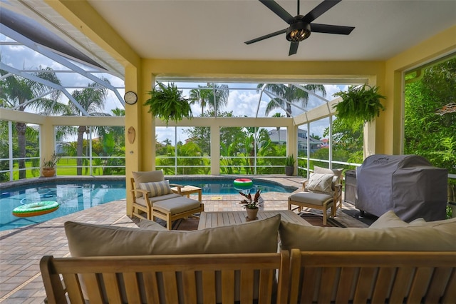 6468 Rubia Cir, Apollo Beach, FL 33572 - sunroom with an outdoor living space, ceiling fan, and a pool