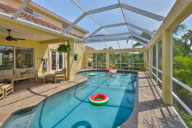 6468 Rubia Cir, Apollo Beach, FL 33572 - outdoor pool with a patio area, an outdoor living space, glass enclosure, and ceiling fan