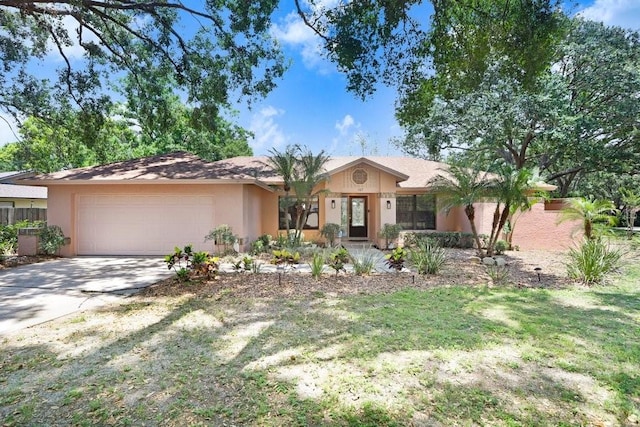 107 Halton Cir, Seffner, FL 33584 - ranch-style house with a garage, concrete driveway, and stucco siding