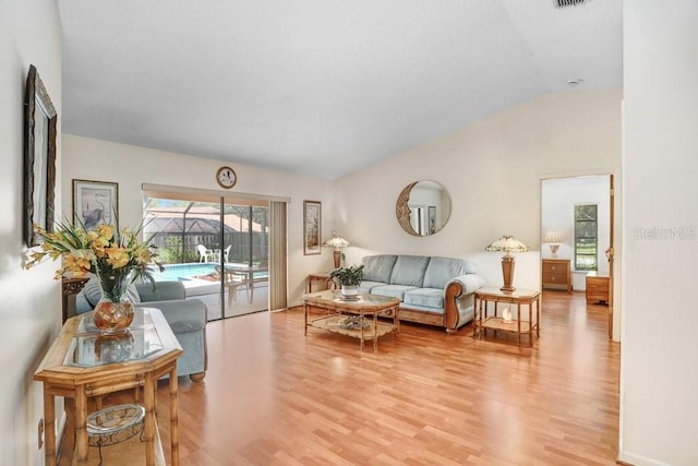 107 Halton Cir, Seffner, FL 33584 - living room featuring lofted ceiling and light wood-style floors