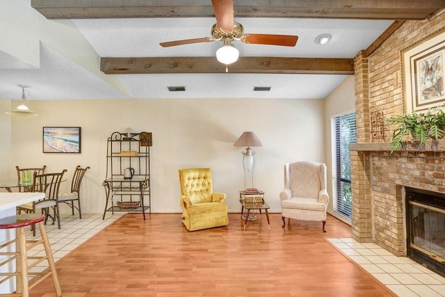 107 Halton Cir, Seffner, FL 33584 - sitting room with light wood-type flooring, a brick fireplace, and ceiling fan