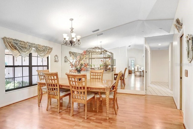 107 Halton Cir, Seffner, FL 33584 - dining space featuring a chandelier, light wood-style flooring, lofted ceiling, and baseboards