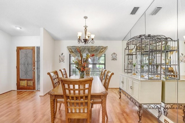107 Halton Cir, Seffner, FL 33584 - dining room with light wood-type flooring, a chandelier, and baseboards