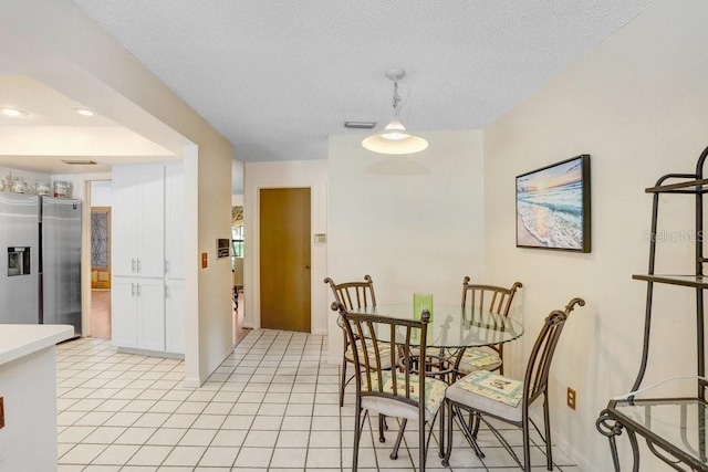 107 Halton Cir, Seffner, FL 33584 - dining room featuring light tile patterned floors and a textured ceiling