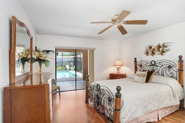 107 Halton Cir, Seffner, FL 33584 - bedroom with access to exterior, wood finished floors, a textured ceiling, and a ceiling fan