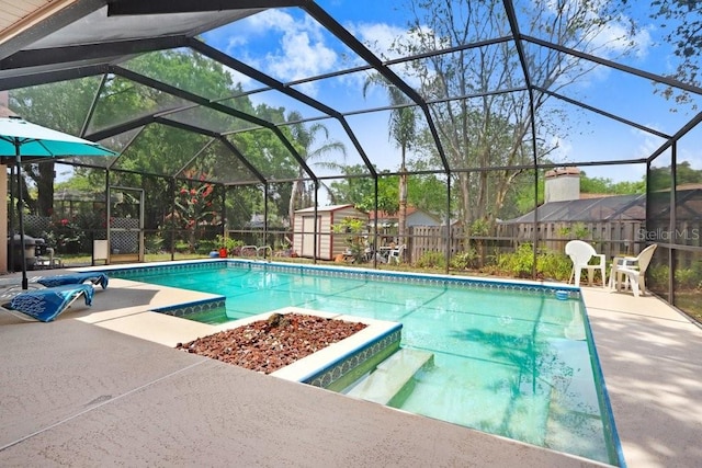 107 Halton Cir, Seffner, FL 33584 - swimming pool featuring a patio area, a lanai, a fire pit, and a fenced backyard