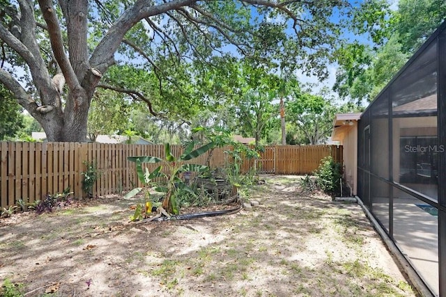 107 Halton Cir, Seffner, FL 33584 - fenced backyard featuring a lanai