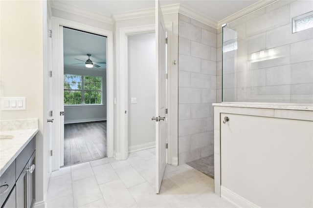 7991 Lake James Blvd, Lakeland, FL 33810 - full bathroom with a walk in shower, ornamental molding, vanity, a ceiling fan, and baseboards