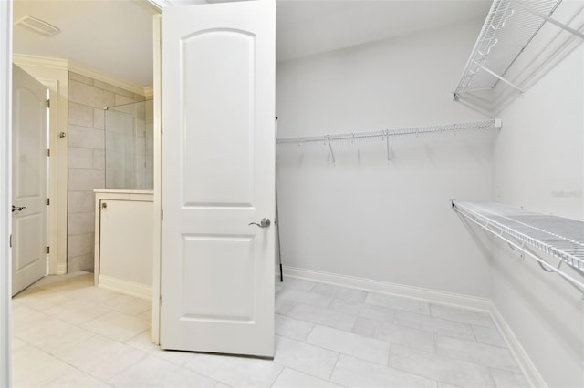 7991 Lake James Blvd, Lakeland, FL 33810 - walk in closet featuring light tile patterned floors