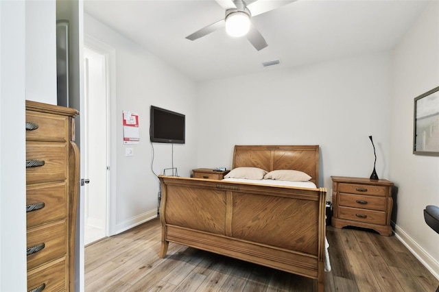 7991 Lake James Blvd, Lakeland, FL 33810 - bedroom featuring light wood finished floors, baseboards, and ceiling fan
