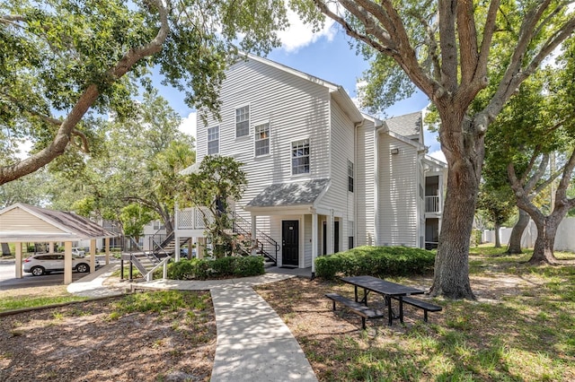 3301 Haviland Ct Unit 203, Palm Harbor, FL 34684 - view of front of home featuring stairs