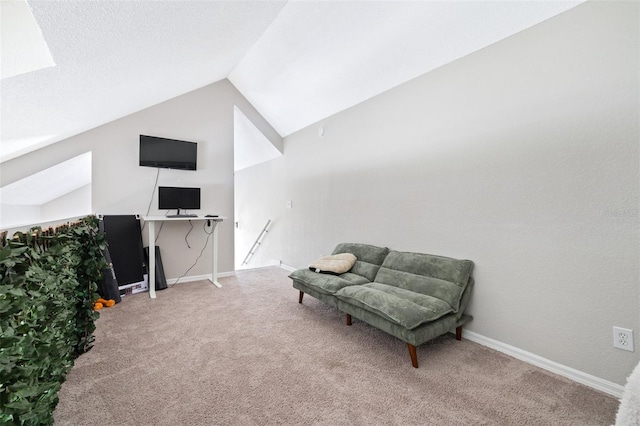 3301 Haviland Ct Unit 203, Palm Harbor, FL 34684 - living area with vaulted ceiling, carpet, an upstairs landing, and baseboards