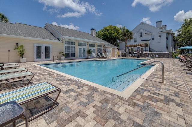 3301 Haviland Ct Unit 203, Palm Harbor, FL 34684 - community pool featuring french doors and a patio