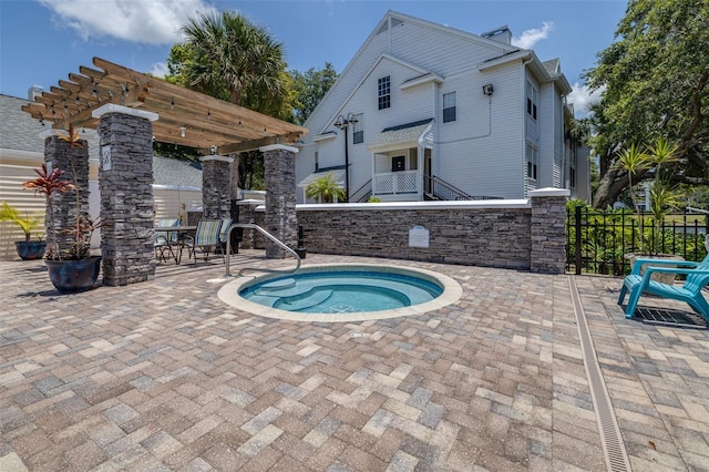3301 Haviland Ct Unit 203, Palm Harbor, FL 34684 - view of pool with a patio area, a community hot tub, and a pergola