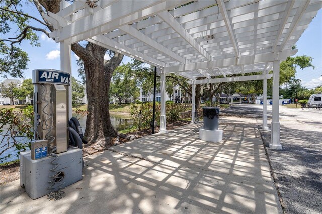 3301 Haviland Ct Unit 203, Palm Harbor, FL 34684 - view of patio featuring a pergola