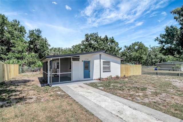 6014 S 82nd St, Tampa, FL 33619 - view of front of home featuring a sunroom