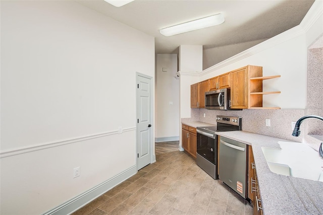 22943 Sills Loop, Land O Lakes, FL 34639 - kitchen with appliances with stainless steel finishes, open shelves, tasteful backsplash, brown cabinetry, and light countertops