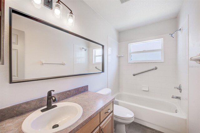 22943 Sills Loop, Land O Lakes, FL 34639 - full bathroom featuring toilet, shower / washtub combination, vanity, and tile patterned floors