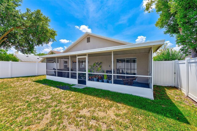 22943 Sills Loop, Land O Lakes, FL 34639 - rear view of property with a sunroom