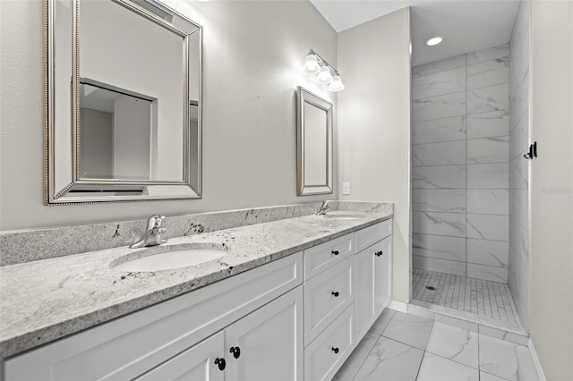 807 Callista Cay Loop, Tarpon Springs, FL 34689 - bathroom featuring marble finish floors, double vanity, a marble finish shower, recessed lighting, and baseboards