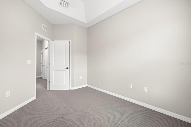 807 Callista Cay Loop, Tarpon Springs, FL 34689 - spare room featuring dark carpet and baseboards