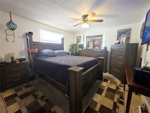 4902 Panorama Ave, Holiday, FL 34690 - bedroom with dark colored carpet, a textured ceiling, and ceiling fan
