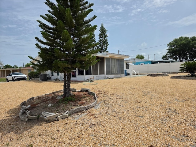 4902 Panorama Ave, Holiday, FL 34690 - view of yard with a sunroom and central AC