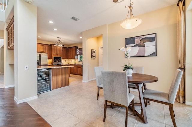 2354 Messenger Cir, Safety Harbor, FL 34695 - dining area featuring wine cooler, recessed lighting, and baseboards