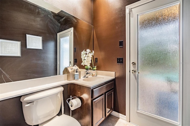 2354 Messenger Cir, Safety Harbor, FL 34695 - bathroom with a textured wall, vanity, toilet, and tile patterned flooring