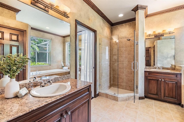 2354 Messenger Cir, Safety Harbor, FL 34695 - full bathroom featuring crown molding, two vanities, a stall shower, tile patterned flooring, and a bath