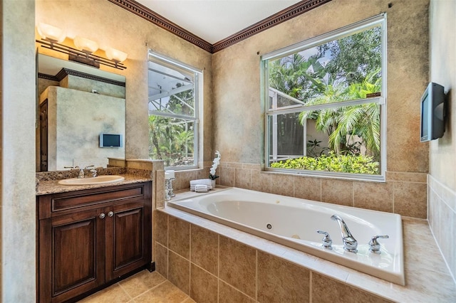 2354 Messenger Cir, Safety Harbor, FL 34695 - bathroom with a tub with jets, vanity, crown molding, and tile patterned floors