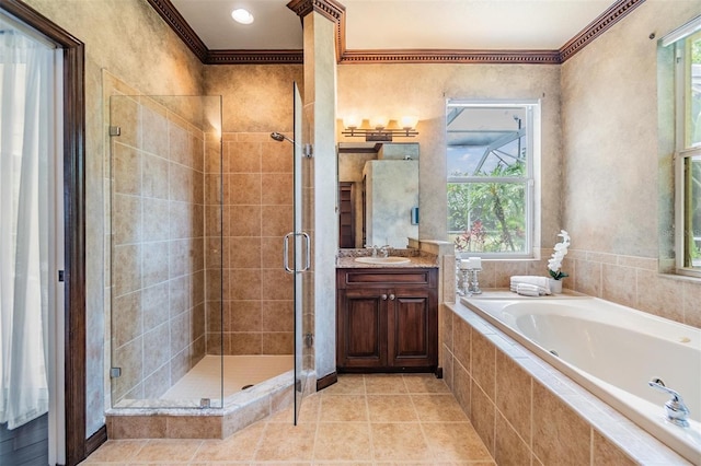 2354 Messenger Cir, Safety Harbor, FL 34695 - bathroom with a garden tub, a shower stall, vanity, crown molding, and plenty of natural light