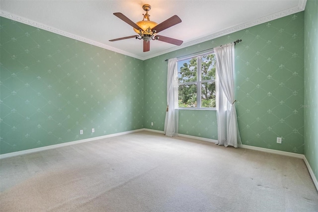 2354 Messenger Cir, Safety Harbor, FL 34695 - empty room with carpet, a ceiling fan, crown molding, and baseboards