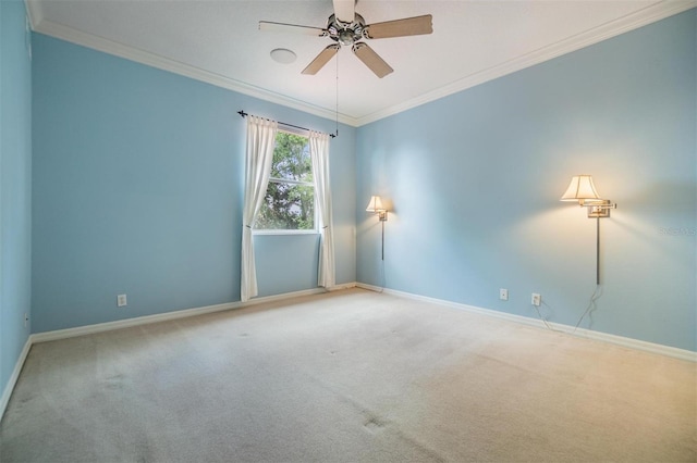 2354 Messenger Cir, Safety Harbor, FL 34695 - spare room with a ceiling fan, carpet floors, crown molding, and baseboards