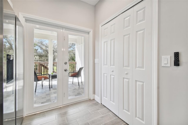 6433 Werner Ave, New Port Richey, FL 34652 - entryway with french doors, baseboards, and wood finish floors