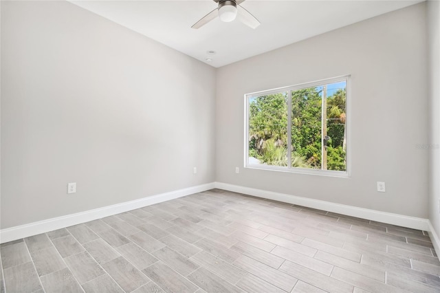 6433 Werner Ave, New Port Richey, FL 34652 - spare room featuring ceiling fan, baseboards, and light wood finished floors