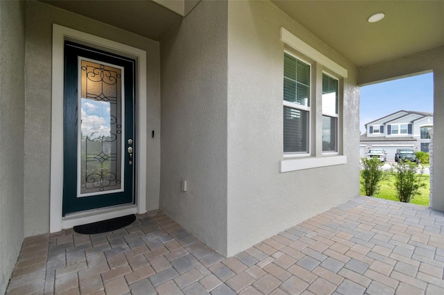 33287 Sycamore Leaf Dr, Wesley Chapel, FL 33545 - view of exterior entry with stucco siding