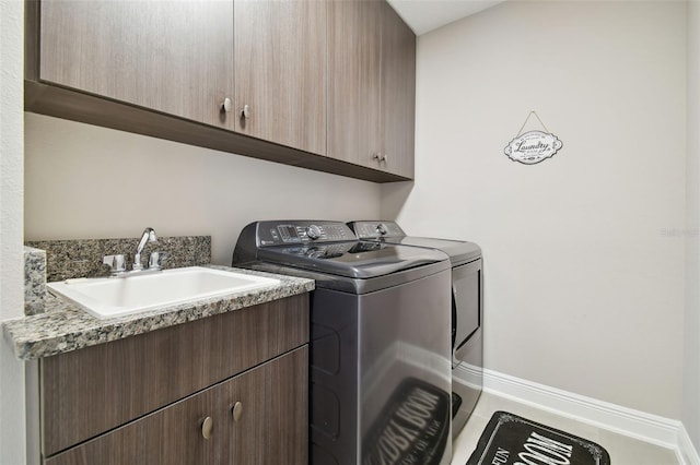 33287 Sycamore Leaf Dr, Wesley Chapel, FL 33545 - laundry room featuring cabinet space, washing machine and clothes dryer, and baseboards