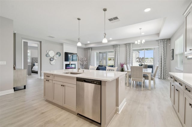 33287 Sycamore Leaf Dr, Wesley Chapel, FL 33545 - kitchen featuring stainless steel dishwasher, light wood-style floors, light countertops, open floor plan, and recessed lighting