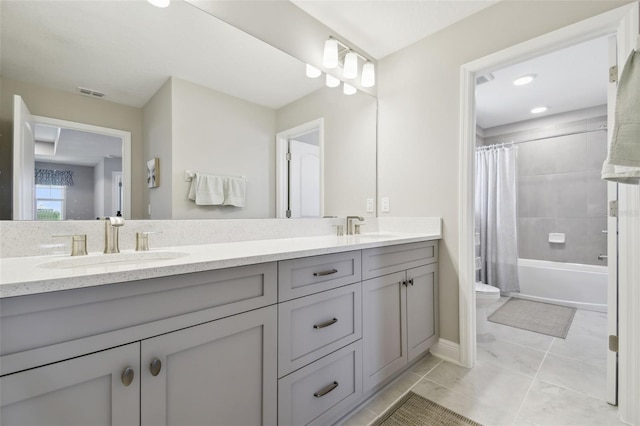 33287 Sycamore Leaf Dr, Wesley Chapel, FL 33545 - bathroom featuring double vanity, toilet, shower / bath combination with curtain, and tile patterned flooring
