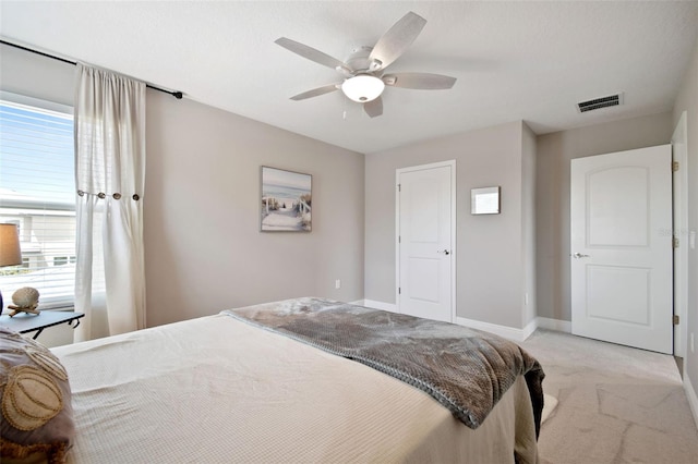 33287 Sycamore Leaf Dr, Wesley Chapel, FL 33545 - bedroom with light colored carpet, multiple windows, baseboards, and ceiling fan