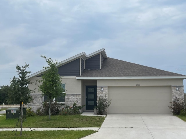 9795 Crescent Ray Dr, Wesley Chapel, FL 33545 - view of front facade with stone siding, a garage, driveway, stucco siding, and a front yard