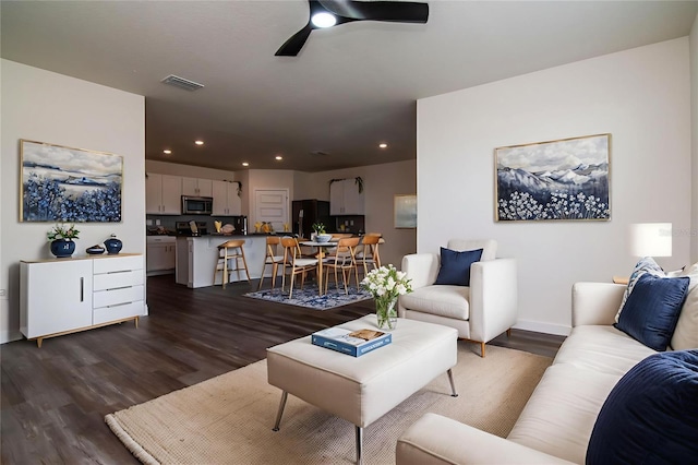 9795 Crescent Ray Dr, Wesley Chapel, FL 33545 - living area with dark wood-type flooring, recessed lighting, a ceiling fan, and baseboards
