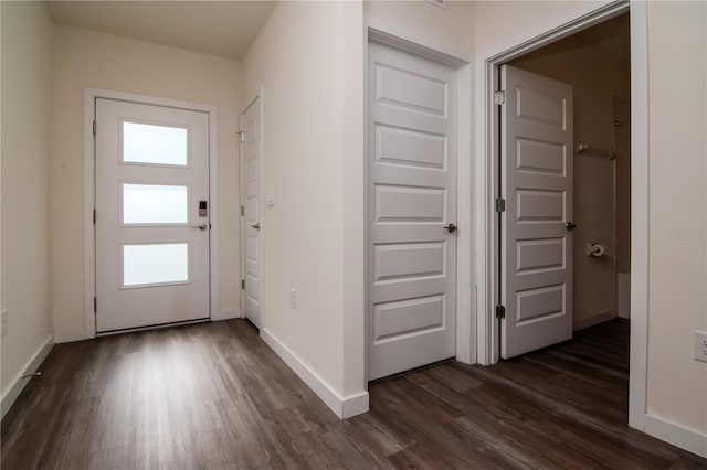 9795 Crescent Ray Dr, Wesley Chapel, FL 33545 - foyer entrance with dark wood-style floors and baseboards