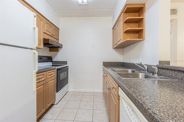 4708 Michael Ct Unit 104, Tampa, FL 33614 - kitchen with white appliances, dark countertops, a sink, extractor fan, and a textured ceiling
