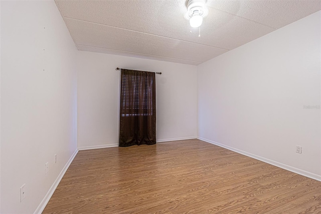 4708 Michael Ct Unit 104, Tampa, FL 33614 - empty room featuring wood finished floors and baseboards