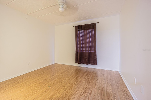 4708 Michael Ct Unit 104, Tampa, FL 33614 - empty room featuring a ceiling fan, wood finished floors, and baseboards
