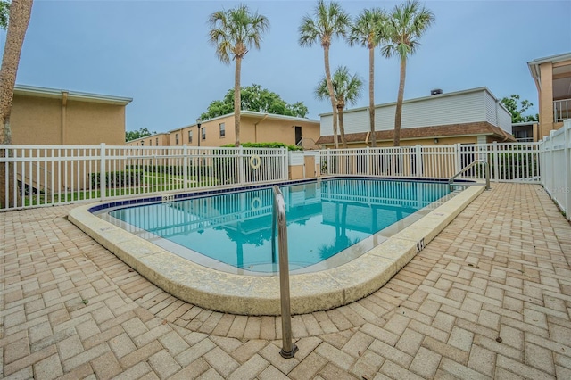 4708 Michael Ct Unit 104, Tampa, FL 33614 - community pool with a fenced backyard and a patio area